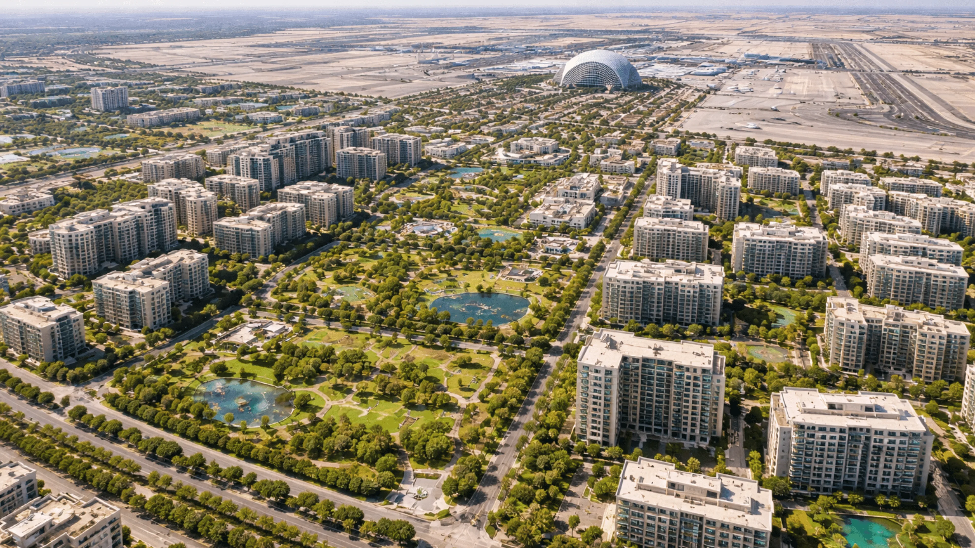 Aerial photograph of Dubai Hills Estate master community showing golf course, villa clusters and Dubai Hills Mall